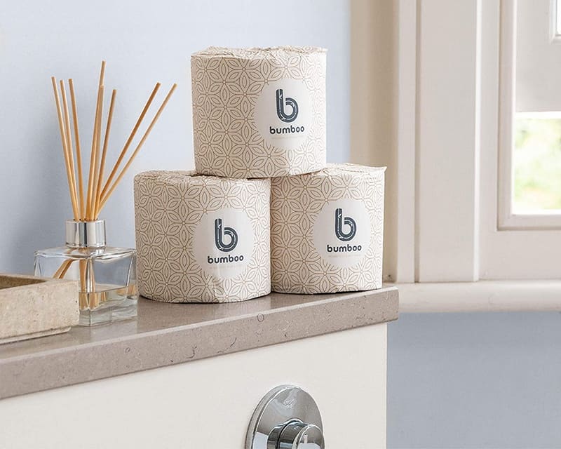 3 rolls of bamboo toilet paper on a bathroom counter top